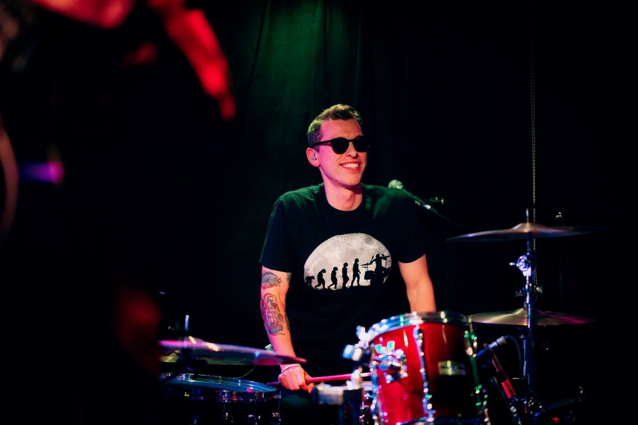 Top Secret Rock Stars performing live at Junction Bar Berlin 2025 - Young drummer sitting on his drumchair smiling